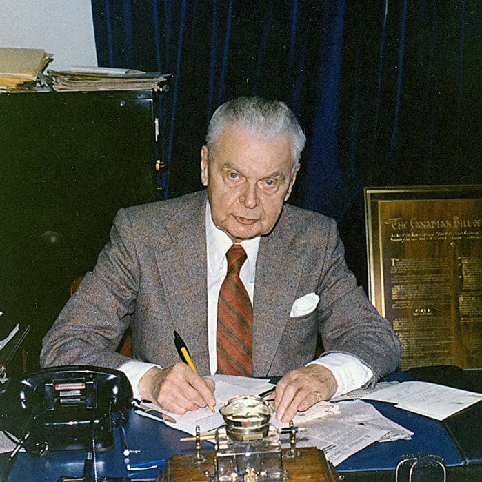 http://alt=%20The%2013th%20prime%20minister%20of%20Canada,%20John%20Diefenbaker,%20sitting%20at%20his%20desk%20signing%20papers.