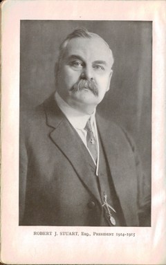http://alt=%20An%20old%20photo%20of%20a%20mustached%20man,%20Robert%20J%20Stuart,%20wearing%20a%20suit%20with%20vest%20and%20tie.