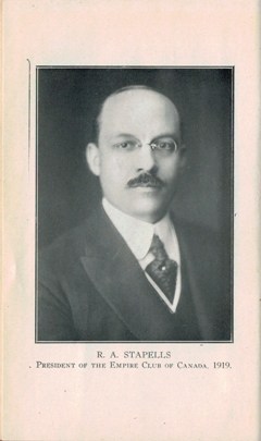 http://alt=%20An%20old%20photo%20of%20a%20mustached%20man,%20R.%20A%20Stapells,%20wearing%20glasses%20with%20a%20suit%20and%20tie.
