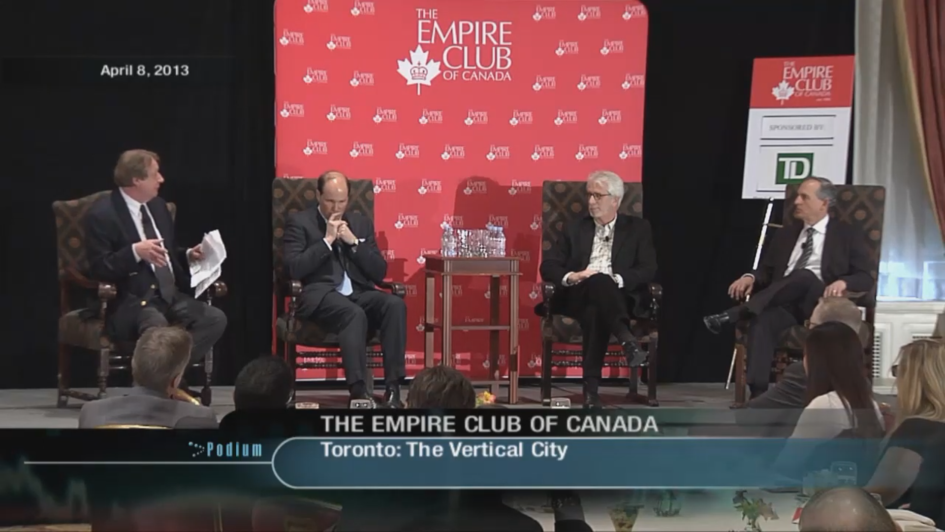 Group of 4 speakers participating in a panel discussion