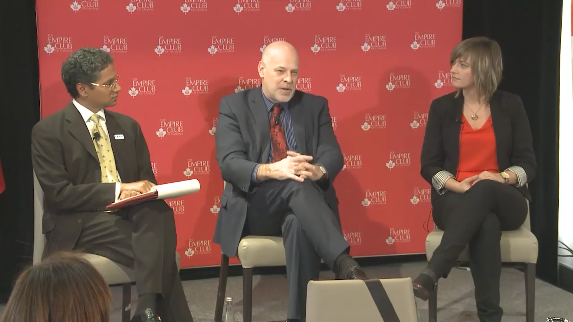 Group of 3 speakers participating in a panel discussion
